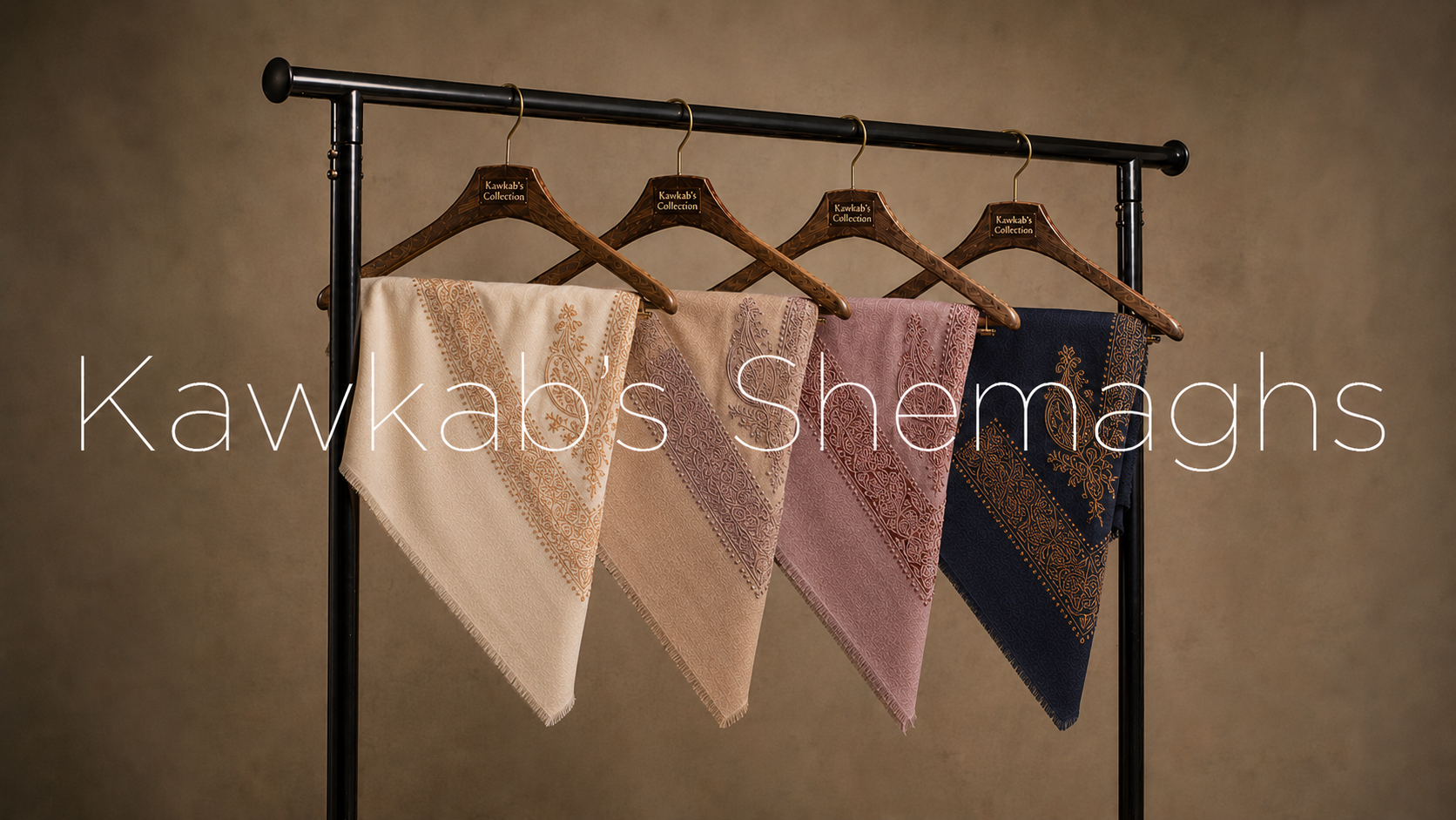 The complete Kawkabs Shemaghs collection on engraved wooden hangers